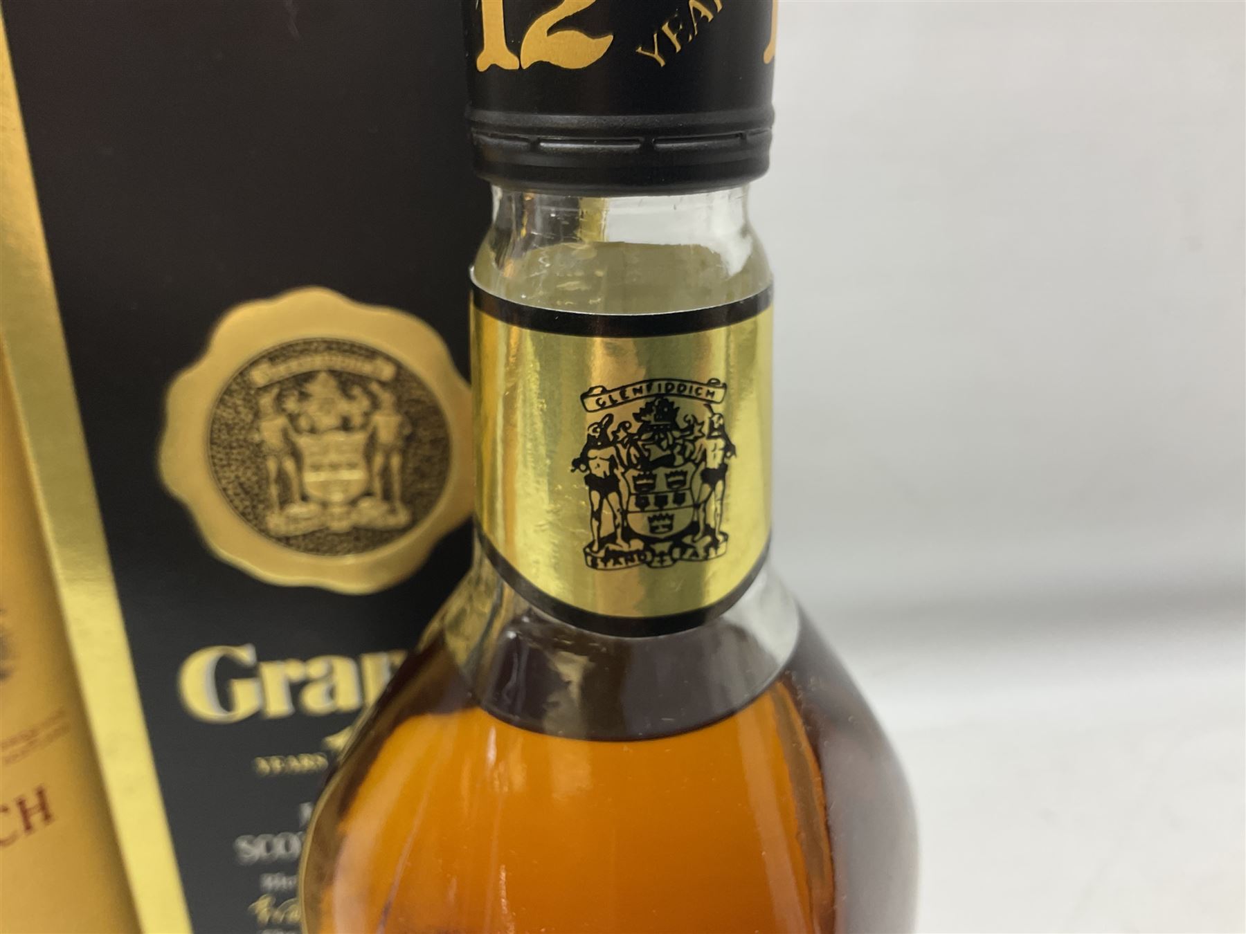 Glenmorangie, ten year old Scotch whisky, 1 litre 43% vol, Grant's twelve year old Scotch whisky 1 litre, 43 G.L and Johnnie Walker Black Label, twelve year old Scotch whisky, 1 litre 43% vol, all boxed (3)