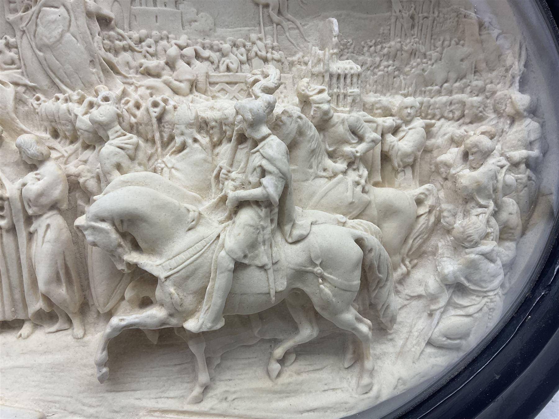 Justin Mathieu; oval high relief plaque depicting a battle scene, within frame H36cm