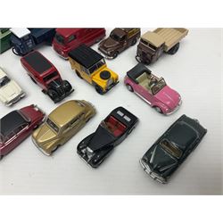 Over forty 1:76 scale die-cast models of cars and commercial vehicles; some boxed; and eight small scale models of motorcycles; all unboxed