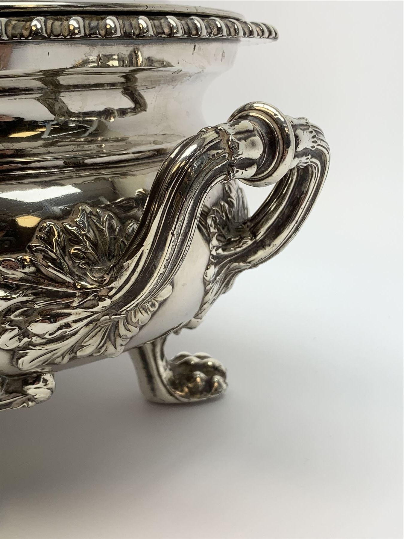 Matthew Boulton silver plated tureen and cover, the body of oval form with twin handles engraved with crest, probably for Whitgreave/Whitgrave family of Moseley Staffordshire, 'Regem Defendere Victum', (To defend the king even in his defeat/To defend the conquered king ), upon four paw feet, the cover with gadrooned rim and foliate loop handle 
