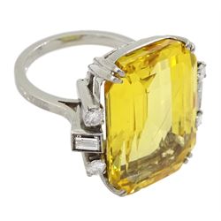 Palladium natural yellow sapphire ring, set with three baguette and round cut diamonds either side, sapphire approx 28.00 carat, with The Gem & Pearl Laboratory report stating no evidence of heat treatment, origin opinion Sri Lanka, colour transparent yellow