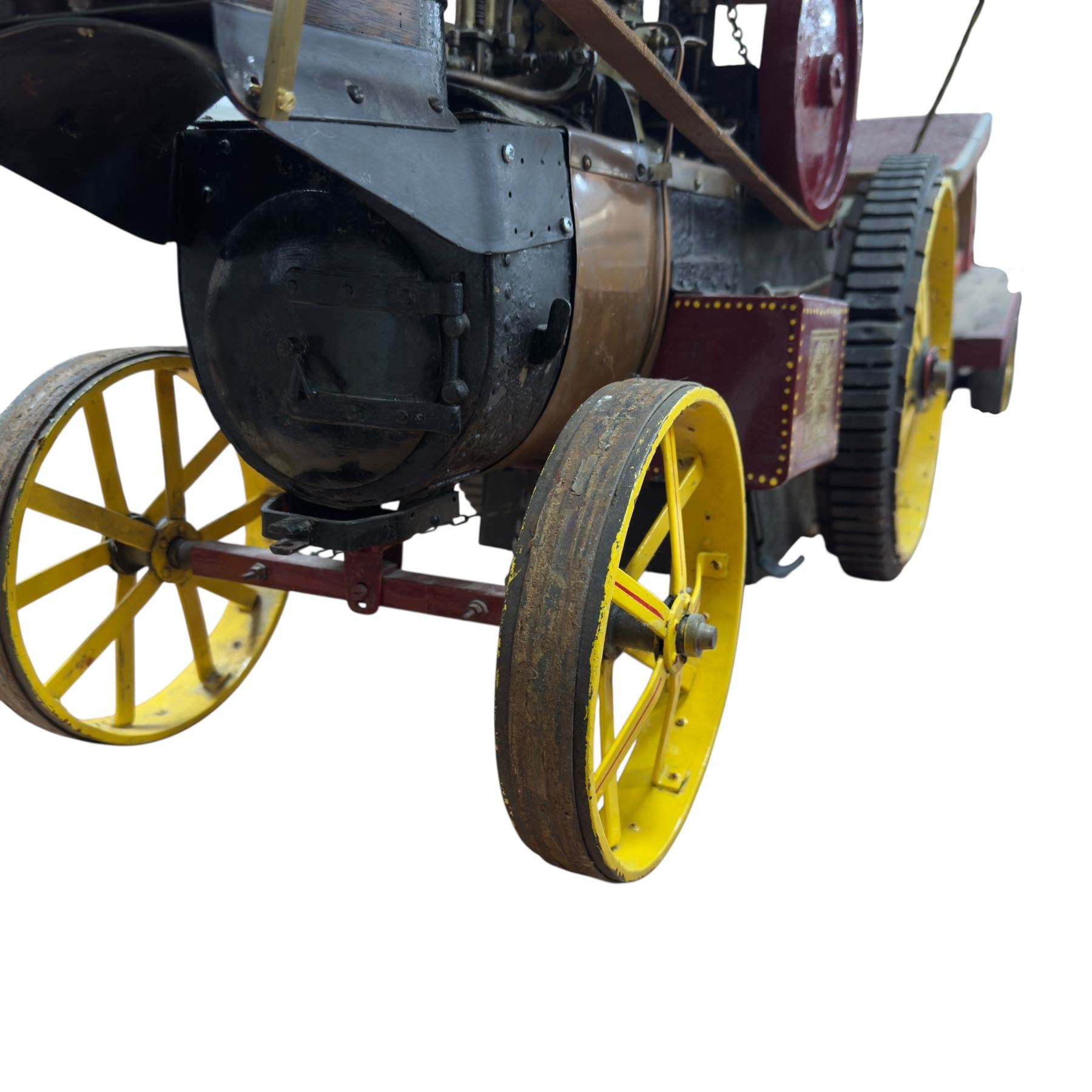 Mid-20th century scratch-built red and yellow painted live-steam scale model of a Showman's Traction Engine, 'Supreme' S.A. Oates & Sons, the simulated full length planked wooden canopy with brass supports and rope edging, with regulator, hand brake, chain steering , dynamo and water feed controls 19cm flywheel, 32cm diameter rear wheels with solid rubber tyres and 21cm diameter front wheels L102cm; together with scratch-built ride-on two-wheel trailer L58cm, and various brass rally plaques for 1980s/1990s.
This is a large, most interesting and comprehensive live-steam working model in need of re-furnishment and some repairs, the boiler has not been tested.