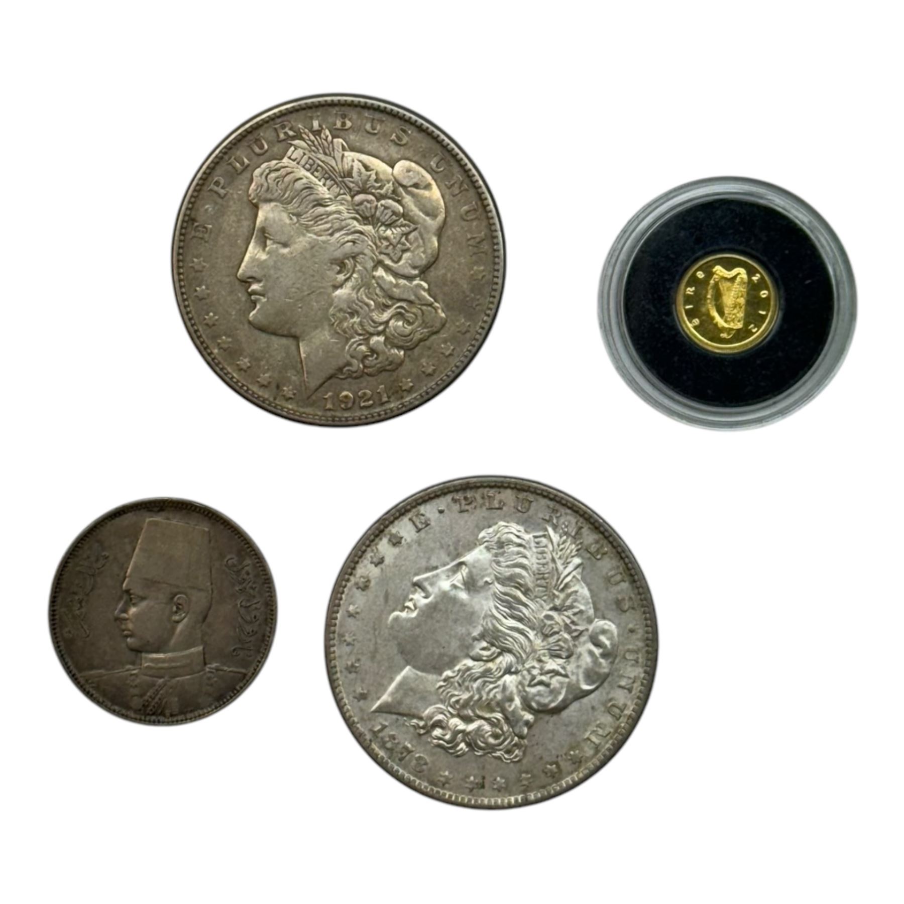 Irish 2012 'Book Of Kells' twenty euro miniature gold coin, 1878 S and 1921 S silver Morgan dollar and an Egyptian silver coin (4)