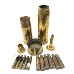 Trench Art - Royal Artillery conical brass ashtray H6cm, tall pedestal brass table lighter, clip of five 50cal. browning machine gun shell cases and nine various size WW1 and later shell cases (12)  