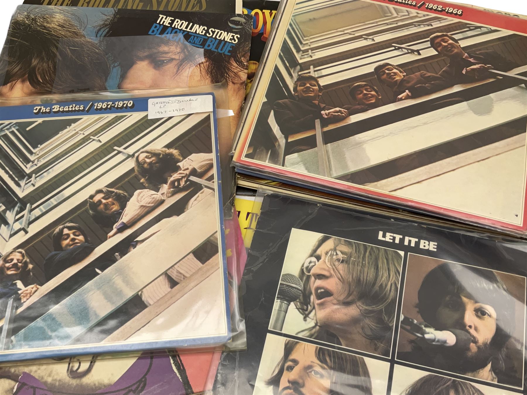 Over seventy LP records 1960s/70s/80s including seven Beatles, five Rolling Stones, Cliff Richard and The Shadows, Isaac Hayes, Jackson Browne, The Osmonds, Beach Boys, Duane Eddy, Buddy Holly, Elvis Presley, Carpenters, Thin Lizzy, Meat Loaf, Black Sabbath, Dubliners etc; and twelve 10