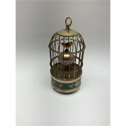 Automation bird cage of predominantly brass construction with central rotating orb and two birds with painted and feathered decoration, H17cm
