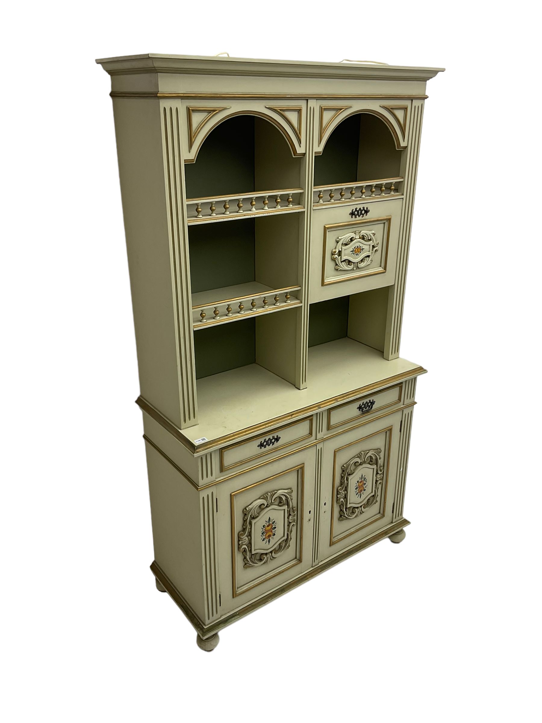 Portuguese painted dresser, two-tier plate rack with spindle gallery and fall-front cupboard, flanked by fluted uprights, fitted with two drawers over two cupboards, the panelled cupboards with floral decoration and a rinceaux border, white painted and parcel-gilt 