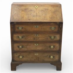 19th century walnut bureau of small proportions, the sloping fall enclosing a fitted interior with shaped pigeonholes and small drawers, above four long graduated drawers with feather banded walnut veneers, fitted with brass swan neck handles and escutcheons, raised on shaped bracket feet