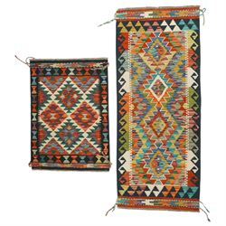 Set of two Kilim hand-woven flat woven rugs, vibrant ground with geometric diamond pattern...