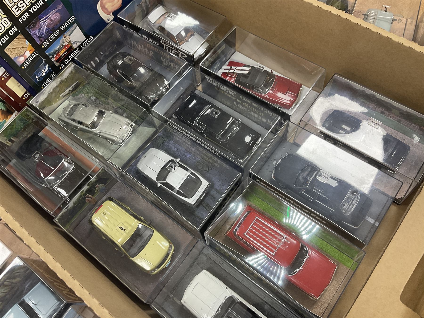 Fabbri James Bond Collection - over one hundred and ten die-cast models in perspex display cases as issued periodically; and a quantity of associated magazines and trading cards, in five boxes