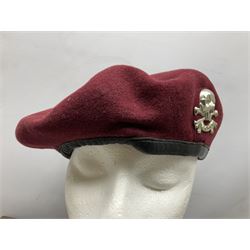 Assorted militaria including ten leather or canvas cartridge and other belts, maroon beret with 17th Lancers cap badge, modern bullet mould, leather and brass shot flask, two knives, shell cases, boomerang etc; in tin deed box