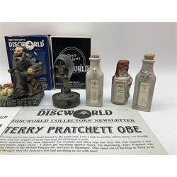 Terry Pratchett Discworld figures, designed by Clarecraft, comprising Cohen the barbarian, DW42, the Patrician, boxed, DW37, three Potions, DW18, DW19, DW20, two Death Bookstamps, DW50, the Gods Dice Box, boxed, DW26, together with two Discworld newsletters, volume 5, August 1998 and volume 6, August 1999. 