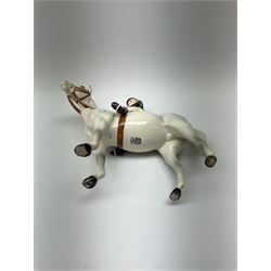A Beswick equestrian figure modelled as a huntswoman on grey horse, with printed mark beneath 