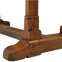 Mouseman - 1937 refectory table, Sir Herbert Baker commission for Westminster Church House, the rectangular adzed plank top above twin octagonal baluster supports united by a pegged stretcher, raised on shaped sled bases carved with a partridge and a loaf of bread, with carved mouse signature to inside leg, by Robert Thompson of Kilburn

The carved loaves reference the original patron, while the partridges are thought to represent Frank Partridge, Bishop of Portsmouth from 1877 to 1941, who played a key role in the founding of Church House and served as its Secretary from 1936 until 1941

Reference
Christie’s ROBERT “MOUSEMAN” THOMPSON; Refectory Table, Lot 188, sold at Christie’s London, commissioned by Sir Herbert Baker KCIE, RA, architect of Church House (opened 1937). Provenance and description available on the Christie’s website
https://www.christies.com/en/lot/lot-4618786