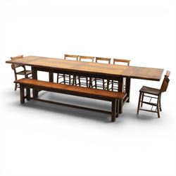 Country pine draw leaf table, bench seat and six chapel chairs, the top of plank construction, with two frieze drawers, additional leaves extending to 320cm, with bench seat and six elm chapel seats