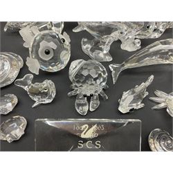 Nineteen Swarovski Crystal sea creatures, to include dolphins, seals, puffer fish, octopus, crabs, together with a quantity Swarovski Crystal shells 