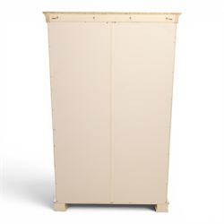 Modern white painted double wardrobe, fitted with two panelled doors, enclosing a hanging rail and shelving, raised on bracket feet