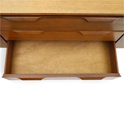 Frank Guille for Austinsuite - mid-20th century teak sideboard, fitted with three central graduating drawers flanked by cupboards, on tapering supports