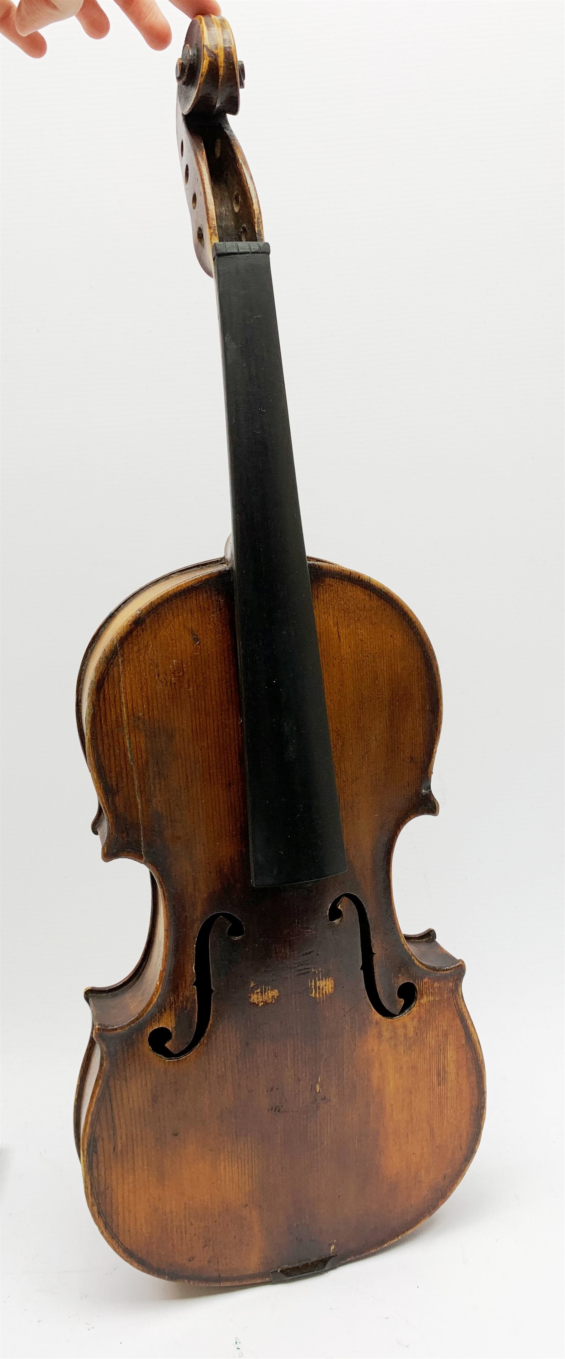  Late 19th century German violin for completion with 36cm one-piece maple back and ribs and spruce top, bears label Copie De Albani Palermo 1633, 59cm overall together with three books on violin construction, restoration and varnishing  