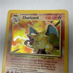Collection of Pokemon trading cards, mostly 1999 Wizards Pokemon cards to include holo Charizard 4/102, first edition holo Machamp 8/102, further holographic cards; Dark Flareon 35/82 and Dark Vaporeon 45/82, cards from themed sets and 4th edition prints; 1998 Electronic Pokédex with cardboard boxes for themed decks Blackout, Overgrowth and Power Reserve Jungle, along with a large quantity of energy and trainer cards 