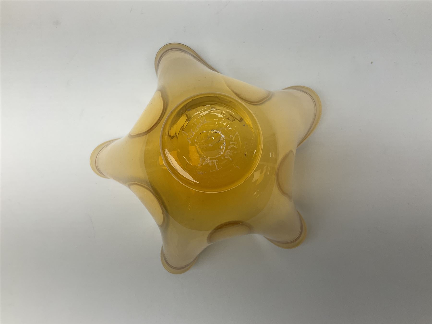 Gillies Jones orange glass bowl with crimped white rim upon a pedestal foot, H11.5cm