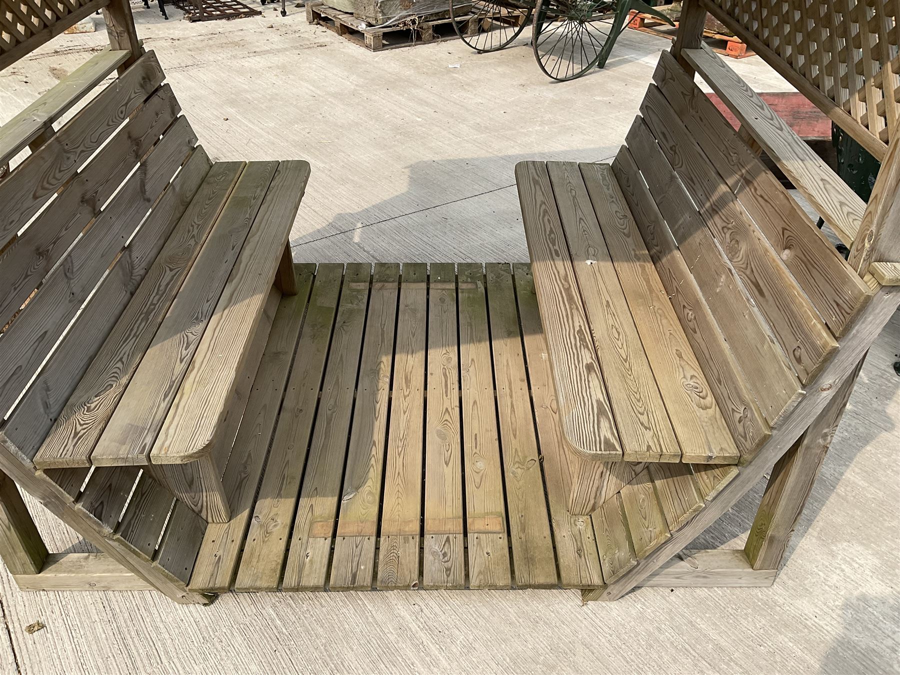 Large wood slatted garden seat with canopy, lattice sides