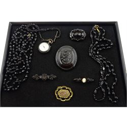 Victorian Whitby jet carved portrait brooch, jet horseshoe brooch and two other Whitby jet brooches, three French jet necklaces, gun metal fob watch and a gilt mourning brooch