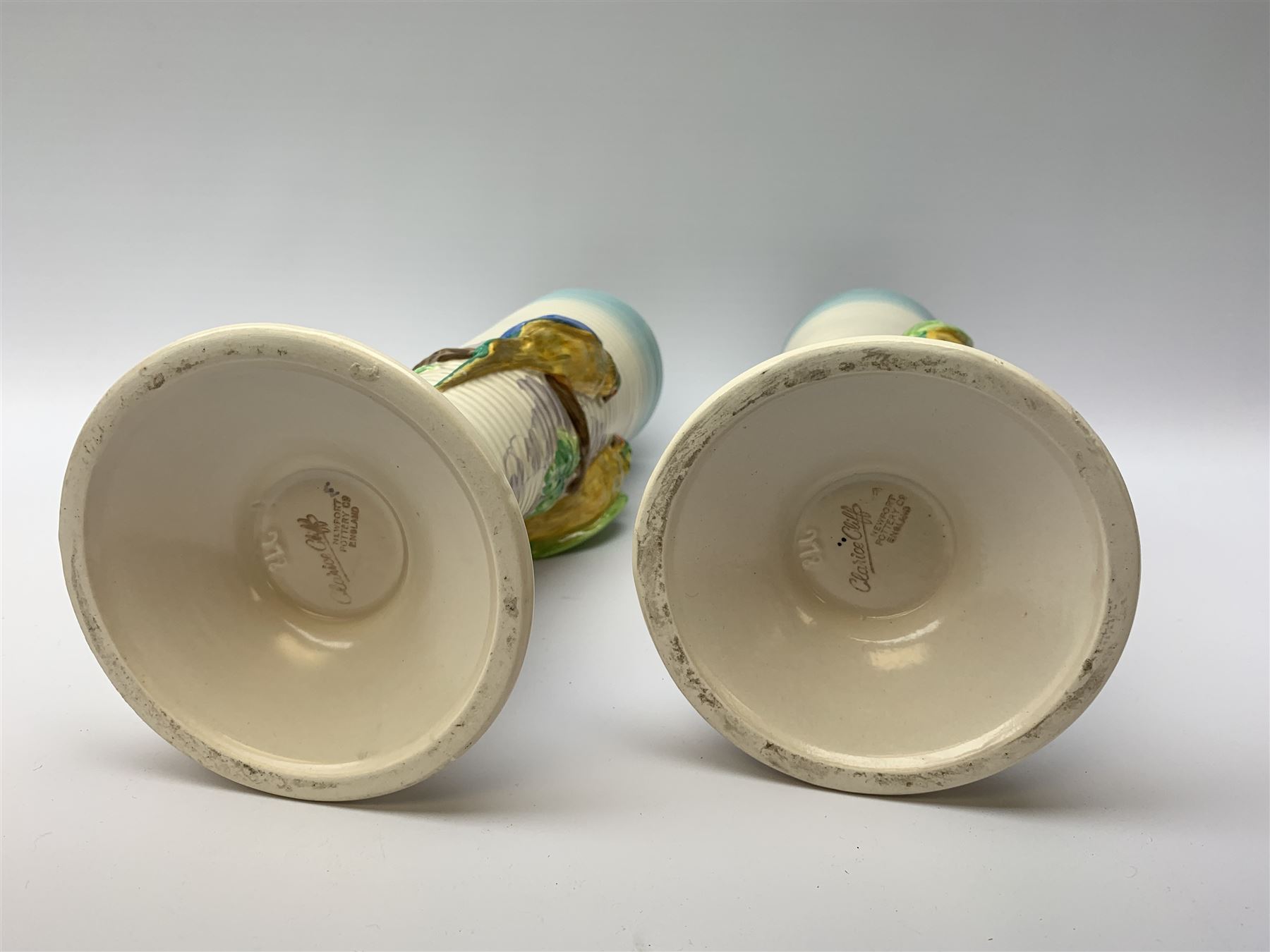 A pair of Clarice Cliff Newport Pottery vases, of tall ribbed conical