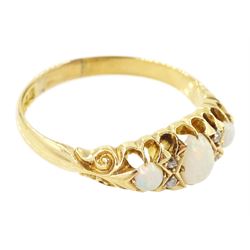 Edwardian 18ct gold opal and diamond ring, three cabochon cut opals, the principal stone with two round cut diamonds set either side, Birmingham 1910