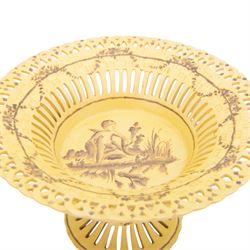 Continental tazza, decorated with swag, the central panel with cerub, marked Toussi Court beneath, H20cm