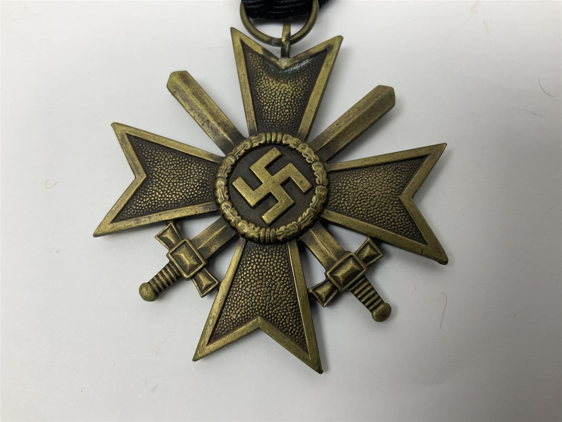 WWII German 'SS' Long Service Medal for four years; Ostfront Medal for the Winter Campaign in Russia of 1941-1942 'Die Medaille Winterschlacht Im Osten'; and War Merit Cross 2nd Class with swords; all with ribbons (3)