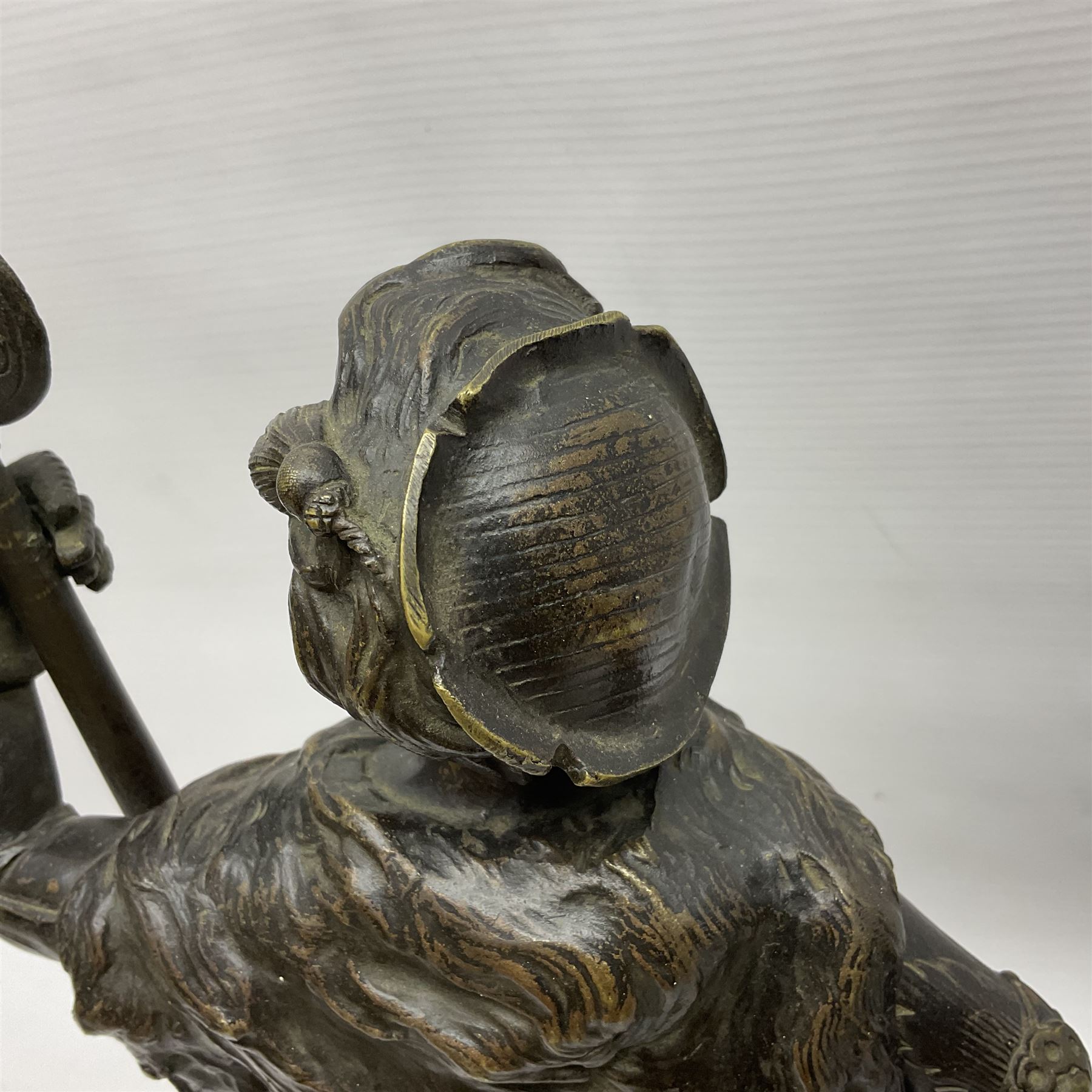 Pair of bronzed figure modelled as a hunter in traditional dress, each holding a pike, H48cm