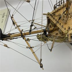 Wooden kit built model of HMS Neptune, 1:90 scale, with detailed rigging to three masts and a row of cannons to either side, upon ebonised wooden base, including stand H71cm