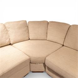 Contemporary modular corner sofa, upholstered in neutral fabric, with curved back fitted with loose cushions and wide seat pads, padded scroll arms and block feet, designed as three detachable sections