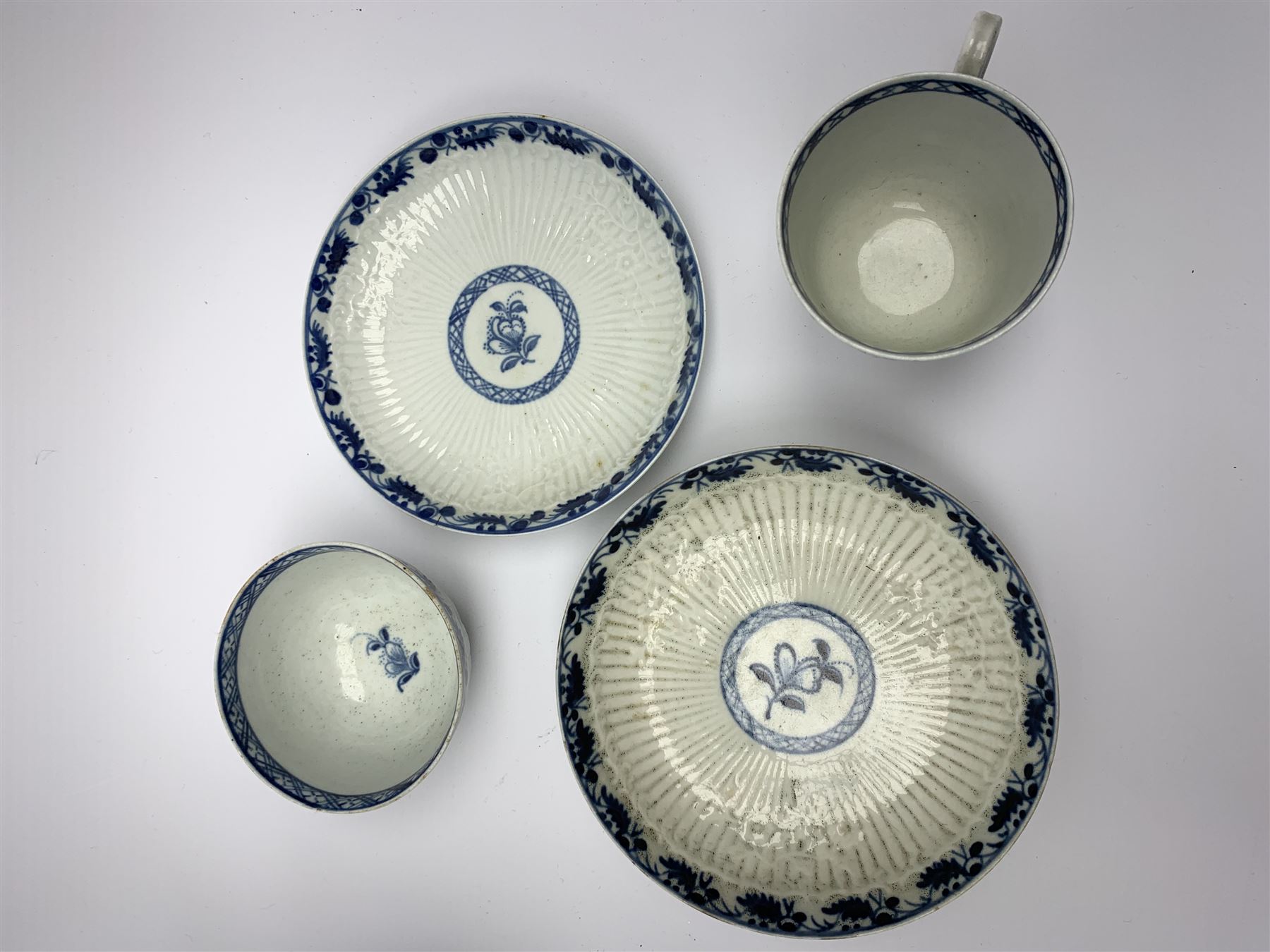 18th century Phillip Christian Liverpool reeded and floral moulded tea wares, comprising coffee pot, tea bowl and saucer, and coffee cup and saucer, each detailed with foliate and trellis borders, teapot H25cm, tea bowl D7.5cm, saucer D13cm 