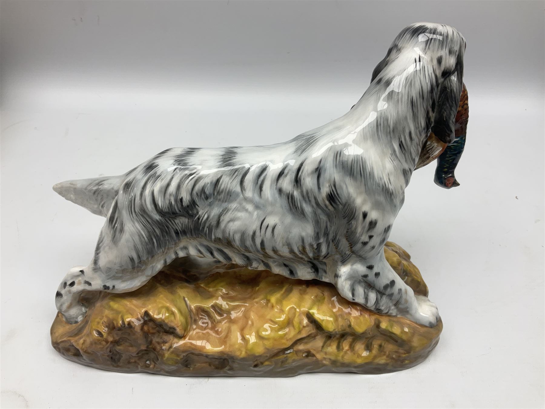 Royal Doulton model of an English setter carrying a pheasant, HN 2529, designed by Frederick Daws, H21cm