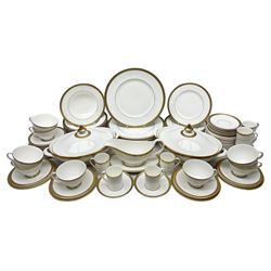 Royal Doulton Royal Gold pattern tea and dinner service for eight, comprising dinner plates, side plates, tea plates, soup bowls, sauce boat and saucer, dessert bowls, coffee cans and saucers, teacups and saucers and two lidded tureens