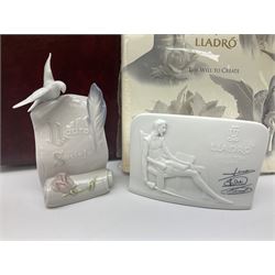 Lladro Collectors Society items, comprising of The Will to Create book, two candle holders; Sailing the Sea no 17665, Dolphins at Play no 17666, Plaque Bringing Us Together, key fob, leather wallet and a members joining pack with plaque, all in original boxes  