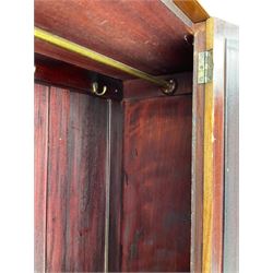 Edwardian inlaid mahogany wardrobe, projecting moulded cornice over central bevelled mirror glazed door, panelled uprights inlaid with trailing bellflowers and foliate decoration, the skirted base fitted with single drawer 