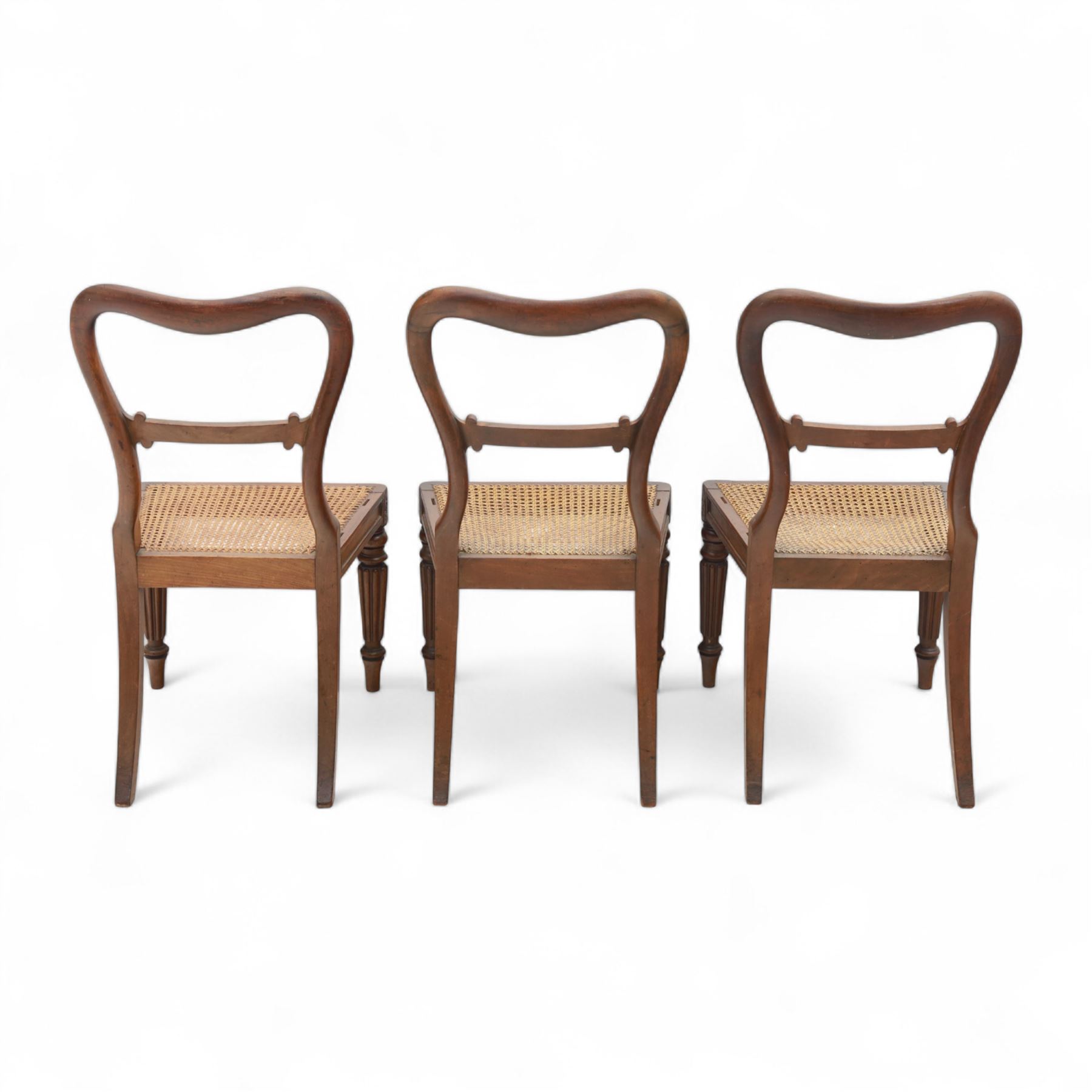 Gillows - Set of six mahogany dining chairs, each with curved top rail carved with floral medallion and scroll detail, fluted front supports, caned seats, the seat rail underside stamped HH identified as H. Howse an apprentice cabinetmaker at Gillows.