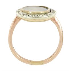 19th century 9ct gold diamond portrait ring, set with an oval miniature of a woman in 18th century dress on ivory, under a glazed panel, with rose cut diamond surround, on later shank. This lot has been registered for sale under Section 10 of the APHA Ivory Act