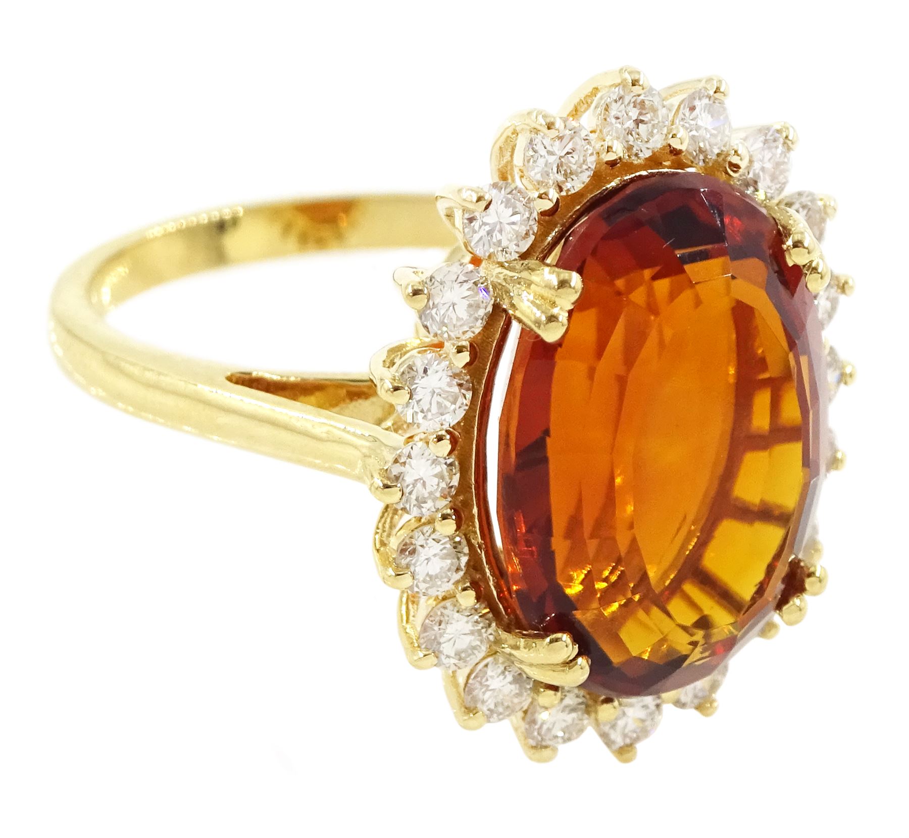 18ct gold citrine and diamond cluster ring, single oval cut citrine of approx 7.35 carat, with round brilliant cut diamond surround, stamped, total diamond weight approx 0.75 carat
