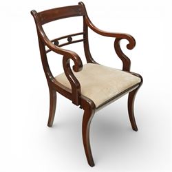 Arthur Brett & Sons - Regency design mahogany extending dining table and eight chairs, the oval top with rounded ends and two extension leaves, raised on twin pedestal supports with swept legs terminating in brass caps and castors, accompanied by a set of eight chairs comprising six single chairs and a pair of carvers, the chairs with curved backs and horizontal splat rails, upholstered seats, sabre legs and scrolling arms to the carvers
(Extends to 252cm)
(Chairs H 86cm, W 52cm)