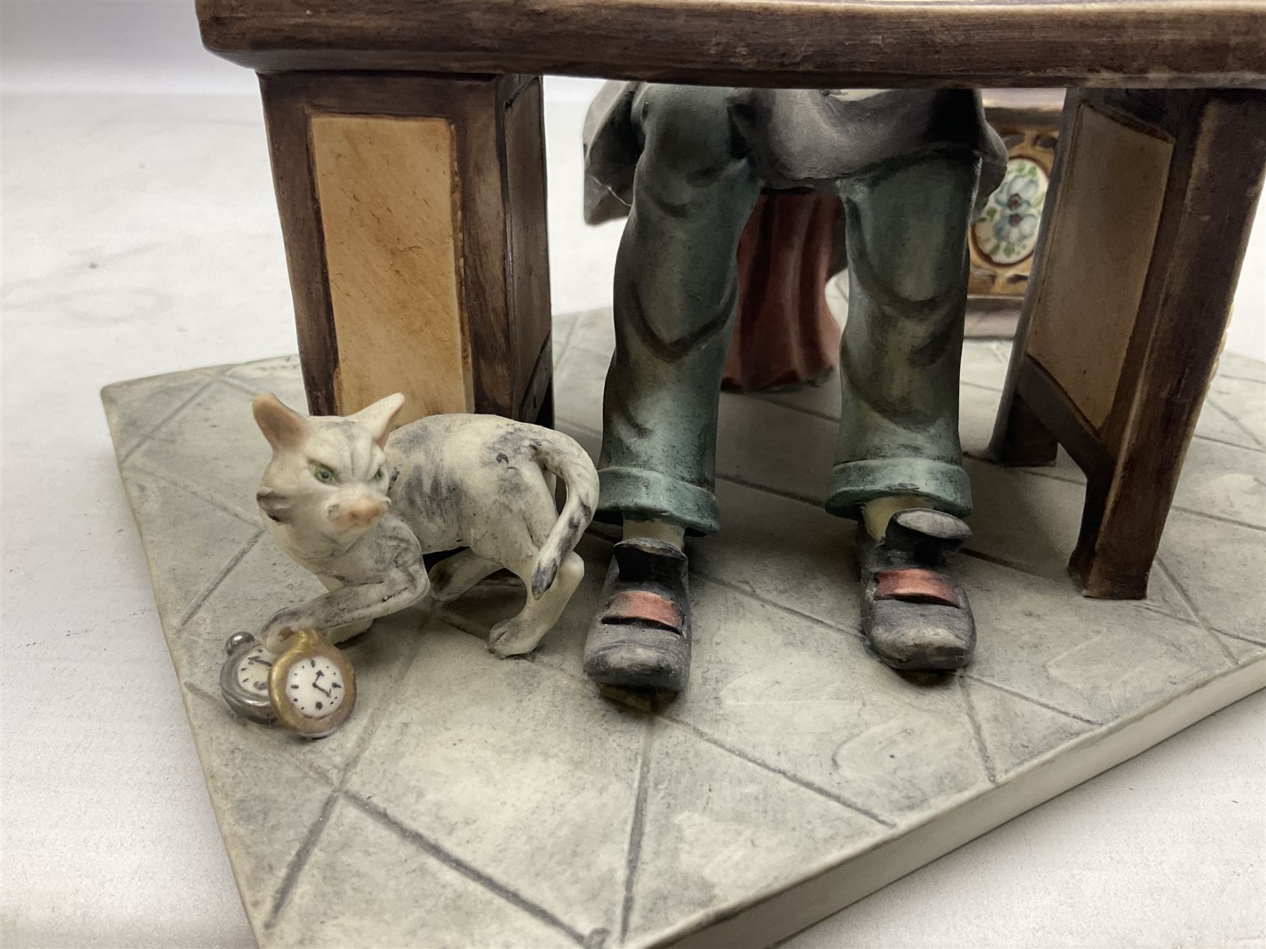 Two Capodimonte figures, comprising The Watchmaker by Curiase and Tramp Seated on a Bench, created by D.Bonalberti, tallest example H24cm