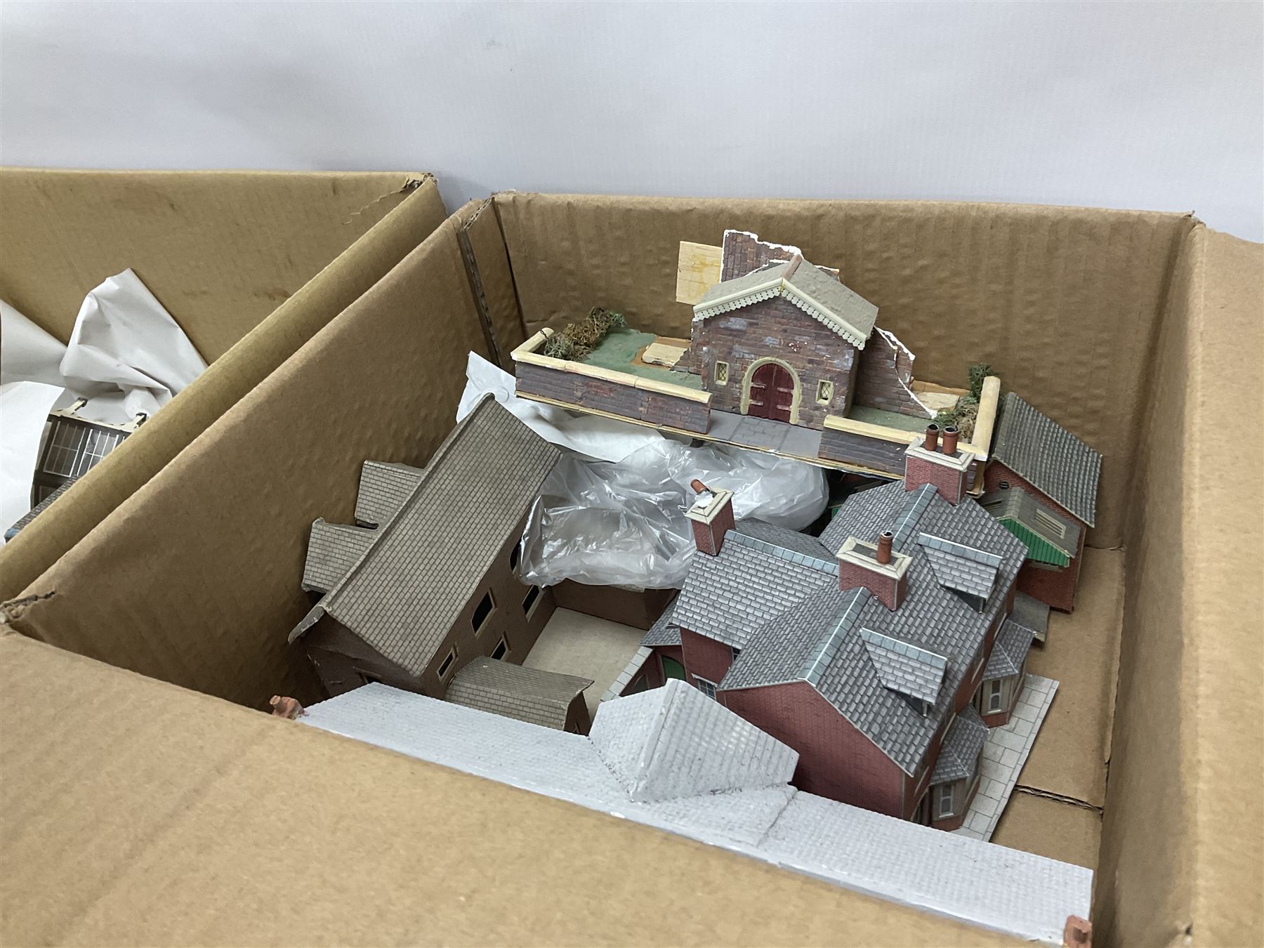 Extensive collection of scratch built buildings for use on ‘00’ gauge model railway layout, small amount of accessories and tools with a quantity of railway magazines and leaflets, in three boxes 