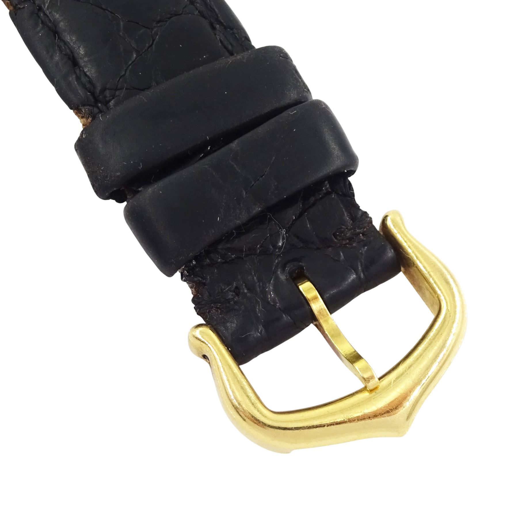 Cartier Tank ladies 18ct gold quartz wristwatch, back case No. M 21001496, white dial with Roman numeral hour markers, on black leather strap with 18ct gold buckle, both by Cartier, hallmarked