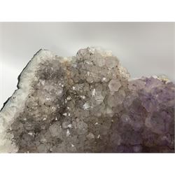 Amethyst crystal geode cluster, with well-defined crystals of various sizes, H13cm, L46cm