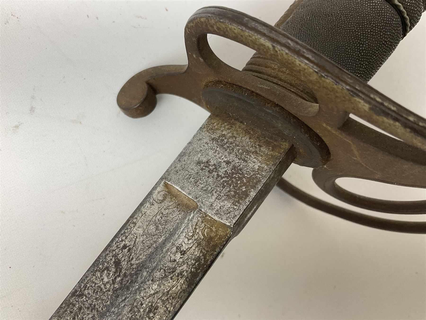 Victorian artillery officer's sword, the 90cm fullered steel blade by E. Thurkle Denmark Street Soho London decorated with Victoria cypher, Regimental crest and 'Royal Artillery', three-bar hilt with stepped pommel and wire-bound fish skin grip; in leather covered scabbard L107cm overall