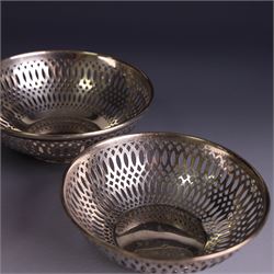 Three 1930s silver bon bon dishes, comprising pair and one larger example, each of circular form with pierced latticework sides, hallmarked Maxfield & Sons Ltd, Sheffield 1936, largest D12cm