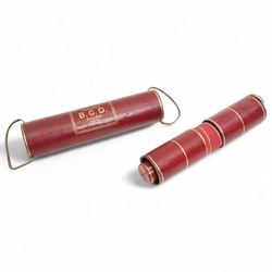 Jaques of London portable B.C.D. board for Backgammon, Chess and Draughts, the inner tube containing thirty two counters and two dice, outer red leather case